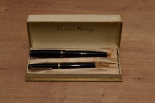 A boxed Parker Victory MK3 button fill fountain pen and pencil set in Black with two narrow bands to