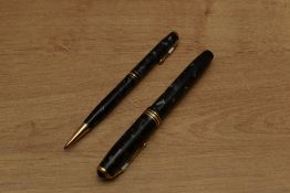 A Conway Stewart 58 lever fill fountain pen and pencil set in Blue Marble with a broad and two