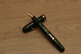 A Conklin lever fill fountain pen in Green vertical stripes with single cap band having Warranted