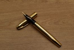 A Sheaffer Triumph Touchdown fill fountain pen in Gold Fill having Sheaffer's 14K nib. Circa 1973.