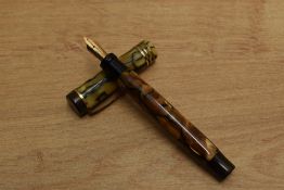 A Parker Duofold Junior button fill fountain pen in Pearl and Black with three bands to a Flat Top