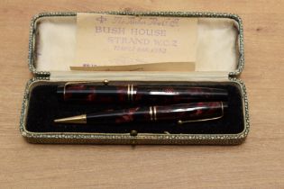 A boxed Parker Junior button fill Fountain pen and pencil set in Burgundy and Black Marble with