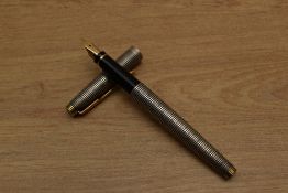 A Parker 75 cartridge fill fountain pen in Sterling Silver Cicele having Parker 585 France 14K
