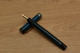A Parker Pastel Lucky Curve button fill fountain pen in Naples Blue with two gold an one black cap