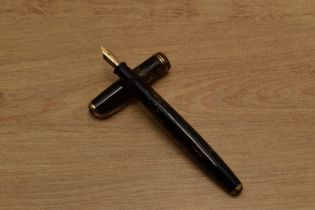 A Parker Vacumatic fountain pen in Brown Shadow Wave design with two narrow cap band having Parker