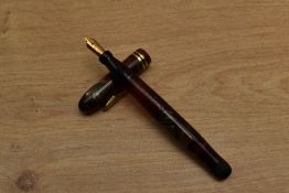A Conklin Endura Wordguage twist fill fountain pen in Green and Red Marble with two narrow cap bands