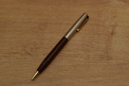 A Parker 51 vacumatic rotary pencil in Cordovan Brown with lustraloy wedding band cap and gold trim.