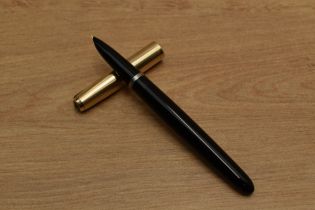 A Parker 51 aerometric fill fountain pen in Black with Rolled Gold converging line cap. Circa 1960