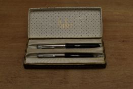 A boxed Parker 51 aerometric fill fountain pen and clutch pencil set in Black with Lustraloy cap.