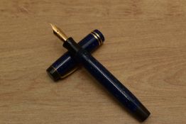 A Parker Duofold Junior Streamline button fill fountain pen in Lapis Lazuli Blue with two bands to