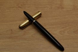 A Parker 51 Vacumatic fill fountain pen in Black with gold filled parallel line and spaced cap.