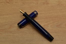 A Parker Duofold Junior streamlined button fill fountain pen in Lapis Lazuli with two narrow cap