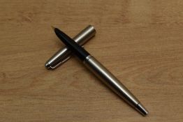 A Parker 45 Coronet cartridge fill fountain pen in Stainless Steel. Circa 1950