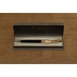 A boxed Parker 51 clutch pencil in Black with Rolled Gold converging line cap. Circa 1956