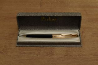 A boxed Parker 51 clutch pencil in Black with Rolled Gold converging line cap. Circa 1956