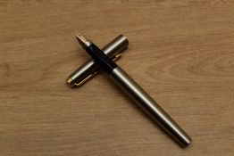 A Parker 75 Flighter Deluxe converter fill fountain pen with gold plated trim having Parker 14K