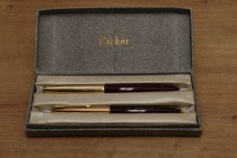 A boxed Parker 51 aerometric fill fountain pen and ballpoint pencil in Burgundy with Rolled Gold