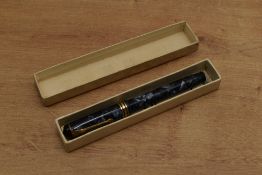A boxed Conway Stewart 388 lever fill fountain pen in Blue Marble with a broad and two narrow cap