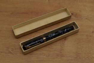 A boxed Conway Stewart 388 lever fill fountain pen in Blue Marble with a broad and two narrow cap
