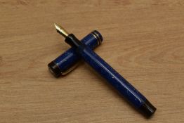 An Osmia Supra Normal button fill fountain pen in Lapis Lazuli Blue with two bands to the flat top