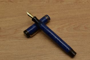 An Osmia Supra Normal button fill fountain pen in Lapis Lazuli Blue with two bands to the flat top