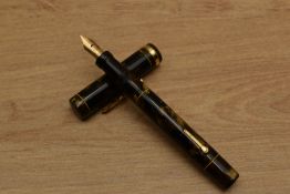 A Conklin Endura lever fill fountain pen in Brown Marble a broad cap band having Conklin Endura nib.