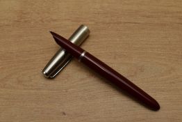 A Parker 21 Standard MkI aerometric fill fountain pen in Red with lustraloy cap. Circa 1948