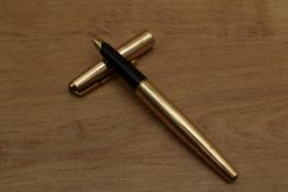 A Parker 65 converter fill fountain pen in Rolled Gold having Parker 14K 585 nib. Circa 1967