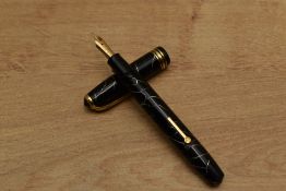 A Conway Stewart 58 lever fill fountain pen in Black Cracked Ice with single broad and two narrow