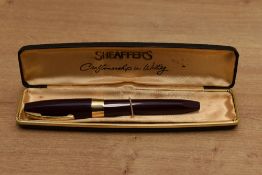 A boxed Sheaffer Pen For Men III snorkel fill fountain pen in Burgundy with Gold trim having