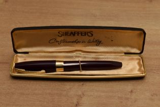A boxed Sheaffer Pen For Men III snorkel fill fountain pen in Burgundy with Gold trim having