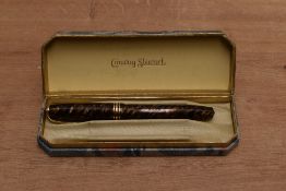 A boxed Conway Stewart 58 lever fill fountain pen in Tiger's Eye with one broad and two narrow cap