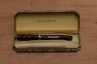A boxed Conway Stewart 58 lever fill fountain pen in Tiger's Eye with one broad and two narrow cap