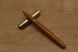 A rare Parker 51 Vacumatic fill fountain pen in Mustard with gold filled twin jewel converging lined