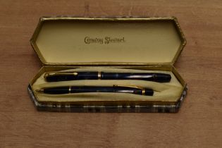 A boxed Conway Stewart 12 lever fill fountain pen and Nippy 5 pencil set in Blue marble with Brown