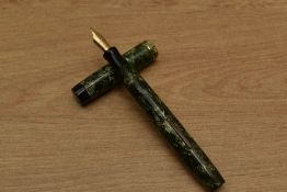 A Valentine 04 lever fill fountain pen in Green Lined with a single narrow cap band having a