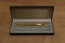 A boxed Parker 75 ballpoint pen in gold plated Millerais pattern