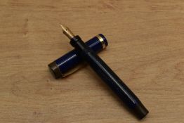 A Parker Duofold Junior button fill fountain pen in Lapis Lazuli with a single band to Flat Top