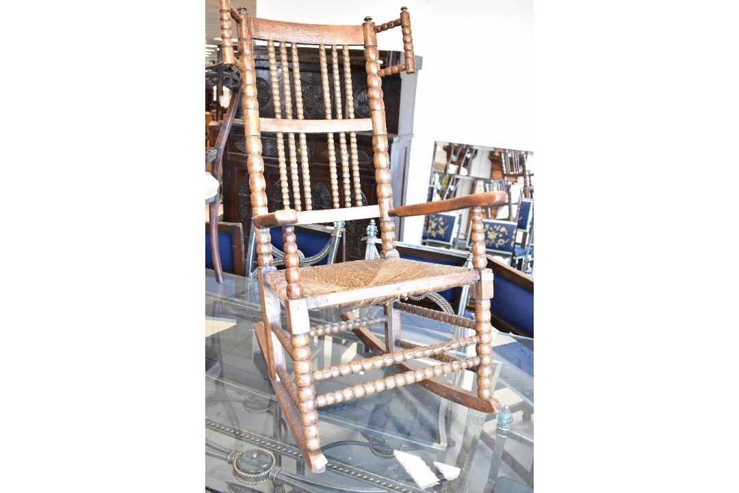 A 19th Century oak knitting chair having rush seat - Image 1 of 3