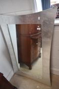 A modern wall mirror having silver coloured frosted/crackle effect frame, approx. 78 x 118cm
