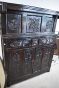A period oak court cupboard of typical design with foliate carving throughout, dimensions approx.