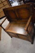 An early 20th Century oak monks bench, width approx. 82cm