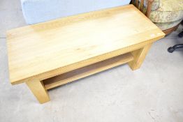 A modern golden oak TV unit or coffee table having rustic ends, dimensions approx. 108 x 45cm