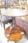 A 19th Century oak pedestal table having circular top, turned column and triple splay legs, diameter