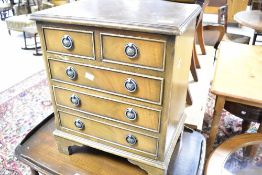 A reproduction Regency dwarf chest of two over three drawers, dimensions approx. Width 42, height