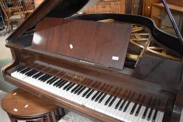 An early 20th Century mahogany cased baby grand piano, Welmar by Bluthner and Co, the case in some
