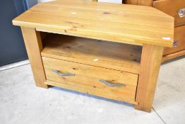 A modern golden oak TV cabinet , width approx. 97cm