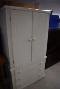 A modern painted MDF and pine wardrobe having triple drawer base, dimensions approx. Height 180