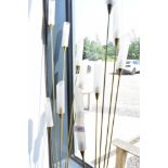 A pair of vintage brass standard lamps , of rush form