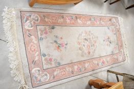 A traditional Chinese fireside rug, approx. 160 x 77cm